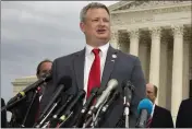  ?? MANUEL BALCE CENETA — THE ASSOCIATED PRESS FILE ?? South Dakota Attorney General Jason Ravnsborg, joined by a bipartisan group of state attorneys general, speaks to reporters in front of the U.S. Supreme Court in Washington.