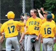  ?? CHRISTINE WOLKIN — FOR DIGITAL FIRST MEDIA ?? Members of the Fort Washington team celebrate a run during their Lower Montco American Legion playoff game against Roslyn at Upper Dublin High School on Thursday.