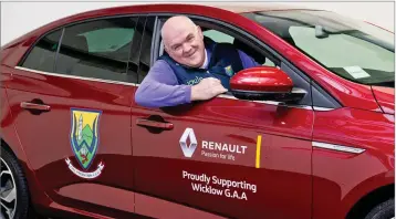  ??  ?? Wicklow Senior County Football Manager John Evans behind the wheel of his new car.