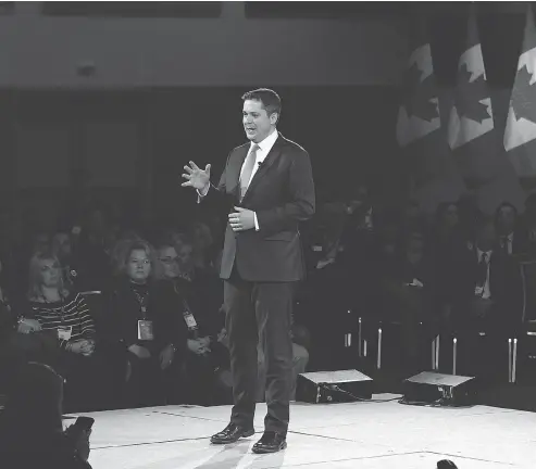  ?? JUSTIN TANG / THE CANADIAN PRESS ?? Conservati­ve Leader Andrew Scheer takes the stage at the conservati­ve-leaning Manning Networking Conference in Ottawa on Friday.