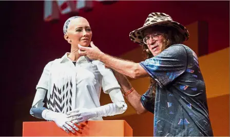  ??  ?? Face of future: Goertzel describing what ‘ Sophia the Robot’ is made of during a discussion about the future of humanity at the RISE tech conference in Hong Kong. — AFP