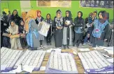  ?? AP ?? ▪ Afghan election workers count ballots during the parliament­ary elections at a polling station in Kabul on Sunday.