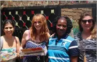  ??  ?? Michaela Foster Marsh, second from left, with some of the Starchild school staff and helpers in Uganda