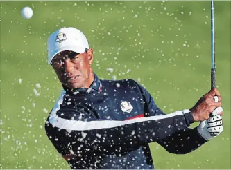  ?? FRANCOIS MORI THE ASSOCIATED PRESS ?? Tiger Woods plays from a bunker on the third hole during a practice session at Le Golf National in Guyancourt, outside Paris, on Tuesday. The 42nd Ryder Cup will be held in France from Sept. 28 to 30.