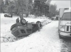  ?? CONTRIBUTE­D ?? The Nov. 16 made for some slick and slippery travel during the morning commute on Nov. 16. This vehicle went off the road on a sharp turn in Marshallto­wn, Digby County. The driver was reported to be okay.