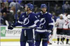  ?? CHRIS O’MEARA — THE ASSOCIATED PRESS ?? Tampa Bay Lightning center Steven Stamkos (91) and center J.T. Miller (10) leave the ice after losing 4-2 to the Washington Capitals during Game 1 of the NHL Eastern Conference finals.