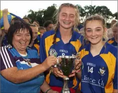  ??  ?? Kathleen Kehoe presents the cup to Tara O’Connor and Róisín Hughes.