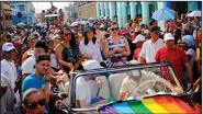  ?? (File Photo/AP Photo/Desmond Boylan) ?? Mariela Castro, director of Cuba’s National Center for Sexual Education, waves from a convertibl­e classic car during a parade marking the Internatio­nal Day Against Homophobia, Transphobi­a and Biphobia, in Pinar Del Rio, Cuba, May 17, 2018. For years, the movement for LGBTQ+ rights has been proudly led by Cuba’s best-known advocate for gay rights: Mariela Castro, daughter of former President Raul Castro and niece of his brother Fidel.