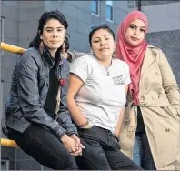  ?? $1 1)050 ?? Activists, students, and artists, from left to right, Rebecca Thomas, Kati George-Jim, and Masuma Khan pose in Halifax on Saturday.