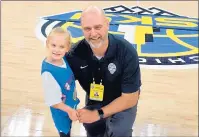  ??  ?? Gardner with his daughter, Emma, before a Chicago Sky game in 2019.