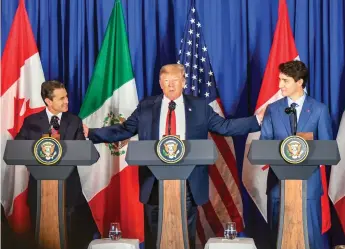  ?? United States Government Flickr photo ?? President Trump, Prime Minister Trudeau and Mexican President Peña Nieto signing the USMCA in Buenos Aires on November 30, 2018.