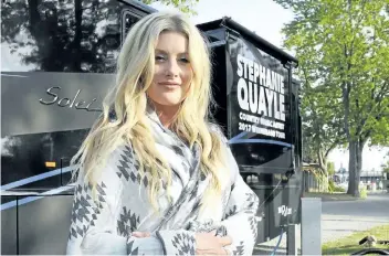  ?? JOHN LAW / NIAGARA FALLS REVIEW ?? Rising country star Stephanie Quayle rolled into the KOA campground in Niagara Falls for a surprise show Saturday night. The Drinking With Dolly singer is doing several intimate gigs to promote her new song, 'Winnebago.'