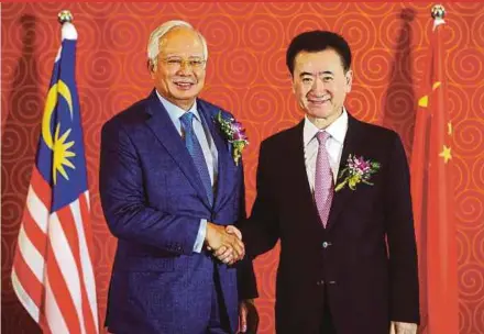  ?? BERNAMA PIC ?? Prime Minister Datuk Seri Najib Razak with Dalian Wanda Group Co Ltd founder Wang Jianlin at a joint press conference in Beijing yesterday.