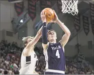  ?? Steve Musco / Yale Athletics ?? Yale’s Noah Yates is fouled while going to the basket on Saturday agaisnt Penn.