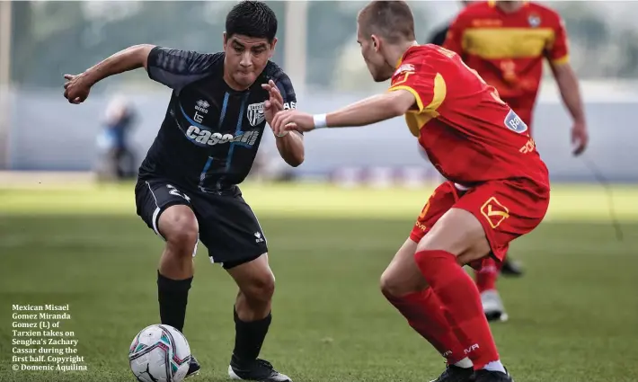  ??  ?? Mexican Misael Gomez Miranda Gomez (L) of Tarxien takes on Senglea's Zachary Cassar during the first half. Copyright © Domenic Aquilina