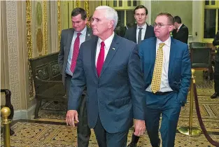  ?? ALEX BRANDON/ASSOCIATED PRESS ?? Vice President Mike Pence departs with White House senior adviser Jared Kushner, background, and incoming White House chief of staff Mick Mulvaney as they depart the Capitol for the night Friday without a bill that would pay for President Donald Trump’s border wall and avert a partial government shutdown.