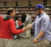  ?? Contribute­d photo by Gail Conner ?? Cedartown head coach Doyle Kelley shakes hands with Cruz Rodriguez during a ceremony announcing his commitment to Shorter on National Signing Day 2018.