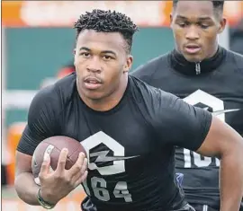  ?? Shotgun Spratling For The Times ?? CHRIS STREET, a running back at San Juan Capistrano JSerra, works out at the Opening Los Angeles Regional at Long Beach City College in February.