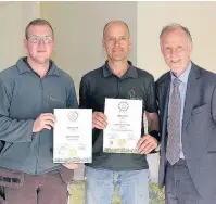  ??  ?? Pictured, from left to right, are Luke Pollard and Michael Liggins receiving the Gold award for the Quorn Grange Hotel, from Jeff Bates, chairman of East Midlands in Bloom.