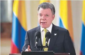  ?? FOTO: AFP ?? El presidente de Colombia, Juan Manuel Santos, anuncia el inicio de las conversaci­ones de paz.