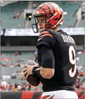  ?? DYLAN BUELL – GETTY IMAGES ?? Bengals quarterbac­k Joe Burrow is questionab­le for tonight's game against the Rams because of a calf injury.