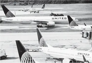  ?? Brett Coomer / Houston Chronicle ?? United Airlines flights were grounded for two hours because of a computer network router early Wednesday, including those at Bush Interconti­nental Airport, its biggest hub.