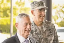  ?? Nati Harnik / Associated Press ?? Jim Mattis (left) quietly noted that the U.S. nuclear arsenal, while old, is still capable of sudden and swift destructio­n.