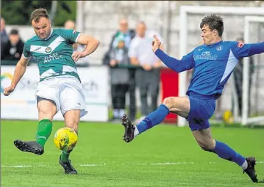  ?? Picture: Ian Scammell ?? Ashford’s Gary Lockyer is put under pressure by Herne Bay’s Dan Johnson