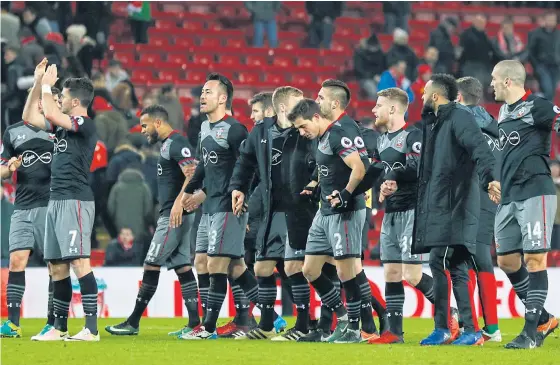  ??  ?? Southampto­n celebrate after beating Liverpool in the League Cup semi-final second leg at Anfield.