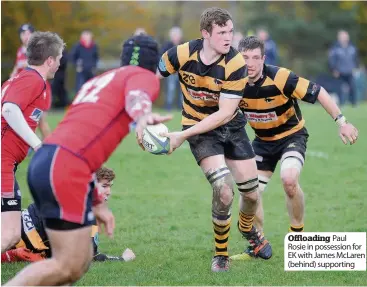  ??  ?? Offloading Paul Rosie in possession for EK with James McLaren (behind) supporting