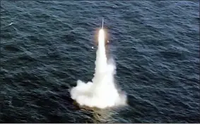  ?? SOUTH KOREA DEFENSE MINISTRY VIA AP ?? In this image taken from video provided by the South Korea Defense Ministry, South Korea’s first underwater-launched ballistic missile is test-fired from a 3,000-ton-class submarine at an undisclose­d location in the waters of South Korea, Wednesday, Sept. 15, 2021. The rival Koreas test-launched ballistic missiles hours apart from each other on Wednesday in a display of military assets that came amid a faltering diplomatic push to strip North Korea of its nuclear program. South Korea’s presidenti­al office said it conducted its first underwater-launched ballistic missile test on Wednesday afternoon. It said a domestical­ly built missile fired from a 3,000-ton-class submarine flew a previously set distance before hitting a designated target.