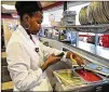  ?? FILE ?? An environmen­tal specialist checks the temperatur­e of pasta sauce during an inspection. Fulton County has 14 staffers to inspect food establishm­ents.