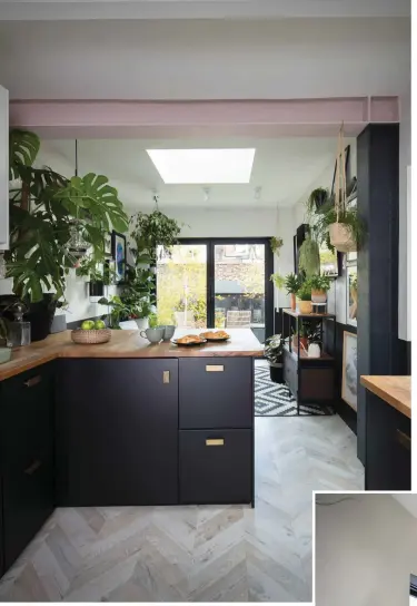  ??  ?? Stephanie and Simon kept the steel beam exposed in the kitchen extension to enhance the sense of height. ‘I’ve painted it in a two-tone effect with black and pink to make it a feature within the room,’ Stephanie explains