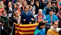  ?? AFP ?? People hold Catalan pro-independen­ce Estelada flags and Basque Country flags during a rally in the northern Spain Basque village of Beasain on Sunday. —