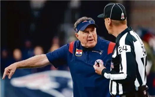  ?? BARRY CHIN/GLOBE STAFF ?? Coach Bill Belichick pointed out a discrepanc­y with an official, but it was an argument he was not going to win.