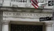  ?? RICHARD DREW — THE ASSOCIATED PRESS FILE ?? This Thursday file photo shows the Wall Street entrance of the New York Stock Exchange. Global stocks fell Friday amid worries about the potential impact of U.S. trade policies and as investors became more cautious about the market’s recent rally.