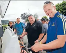  ?? Photo: EMMA ALLEN ?? Mucking in: Party time at the Sullivans last week as Gary Timms, left, and Mark Hodren man the barbecue.