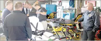  ?? Keith Bryant/The Weekly Vista Bella ?? Vista Firefighte­rs look over the new power cots.