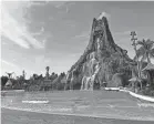  ?? EVE CHEN/USA TODAY ?? Volcano Bay’s iconic volcano towers over the park’s wave pool and can been seen from outside of the property.