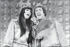  ?? Associated Press ?? Sonny, right, and Cher sing during a taping of “The Danny Thomas Special” in Los Angeles. Cher has sued the widow of her former musical partner and ex-husband Sonny Bono over royalties for Sonny and Cher songs, including “I Got You Babe” and “The Beat Goes On.”