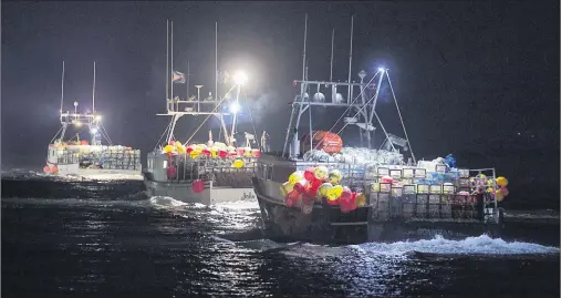  ?? ANDREW VAUGHAN/THE CANADIAN PRESS ?? Lobster boats head to drop their traps from Digby, N.S. on Saturday. When police confirmed two fishing boats had been torched earlier this week in western Nova Scotia, a simmering dispute over the province’s Indigenous lobster fishery suddenly took on...