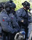  ??  ?? Armed police at Parsons Green tube station in London