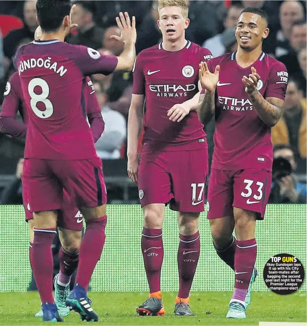  ??  ?? TOP GUNS Ilkay Gundogan laps it up with his City team-mates after bagging the second goal last night for the Premier League champions-elect