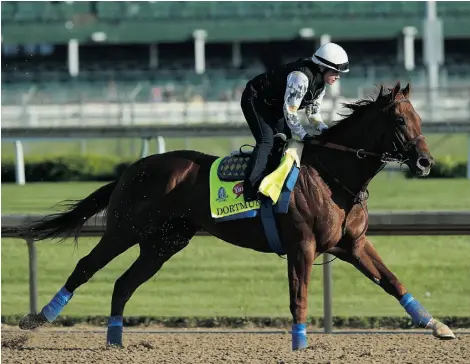  ?? ANDY LYONS/ GETTY IMAGES ?? American Pharoah’s stablemate Dortmund runs on the track during morning training for the Kentucky Derby at Churchill Downs on Thursday in Louisville, Kentucky. Dortmund comes into the Derby well-prepared; he has proven himself in tough, head-to-head...