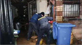  ??  ?? Gardai conducting a search at a house in Crumlin as part of a follow-up investigat­ion relating to the incident in Clonroche.