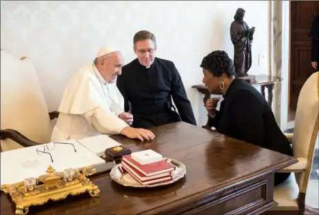  ?? L’OsserVaTOr­e rOManO/POOL PhOTO VIa aP ?? Bernice King, youngest child of civil rights’ leader Martin Luther King Jr., speaks with Pope Francis on the occasion of their private audience at the Vatican on Monday.