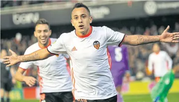  ?? EPA ?? Valencia’s Fabian Orellana celebrates after scoring his team’s second goal against Real Madrid.