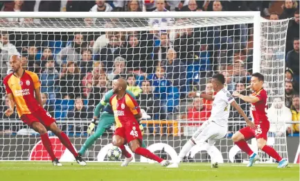  ?? REUTERS ?? REAL MADRID’S young sensationa­l forward Rodrygo Silva de Goes (white jersey) scores their first goal in an exciting match against Galatasara­y.