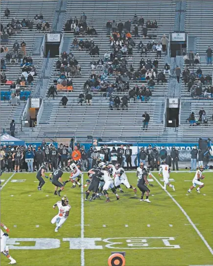  ?? JOHN J. KIM/CHICAGO TRIBUNE ?? Relatives of Northweste­rn players watch from the stands in the second quarter Saturday against Maryland at Ryan Field in Evanston.