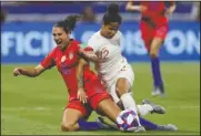  ?? The Associated Press ?? TANGLED COMPETITOR­S: England’s Demi Stokes, right, and United States’ Carli Lloyd duel for the ball during the Women’s World Cup semifinal soccer match Tuesday.